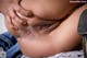 A close up of a woman's stomach with her hands on her stomach.